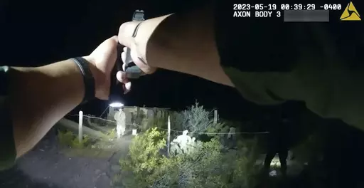 In this image taken from body camera video released Thursday, June 22, 2023, by U.S. Customs and Border Protection, an agent points a gun at tribal member Raymond Mattia, early Friday, May 19, in Tohono O'odham Nation, in southern Arizona. CPB said that agents were concerned that Mattia may have been carrying a handgun during the encounter in which Mattia was fatally shot. (U.S. Customs and Border Protection via AP)