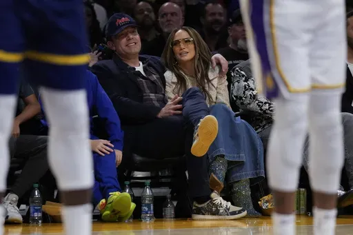 Ben Affleck and Jennifer Lopez watch an NBA basketball game between the Golden State Warriors and the Los Angeles Lakers in Los Angeles, March 16, 2024. (AP Photo/Ashley Landis, File)