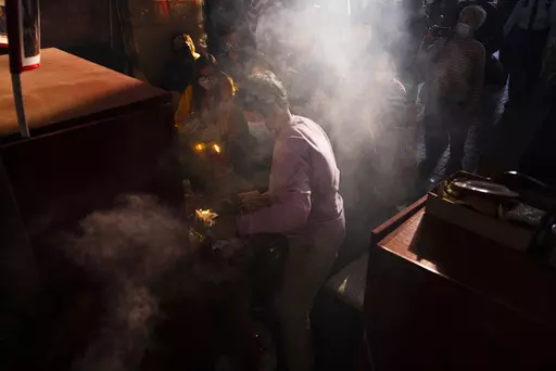 Ho Pan-yong, a 60-year-old practitioner, performs a "villain hitting" ceremony on the day of "ging zat," as pronounced in Cantonese, which on the Chinese lunar calendar literally means "awakening of insects", under the Canal Road Flyover in Hong Kong on Monday, March 6, 2023. People holding a grudge may have found a way to release it in Hong Kong’s “villain hitting” ritual. To relieve themselves from a bad mood, customers paid ritual practitioners who work underneath the Canal Road Flyover