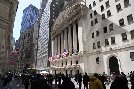Pedestrians walk past the New York Stock Exchange building on March 25, 2024, in New York. Global shares have mostly declined on Friday, April 5, 2024, as investors looked to a key U.S. jobs report due later in the day to gauge the health of the economy and see what the Federal Reserve might do on interest rates. (AP Photo/Frank Franklin II, File)