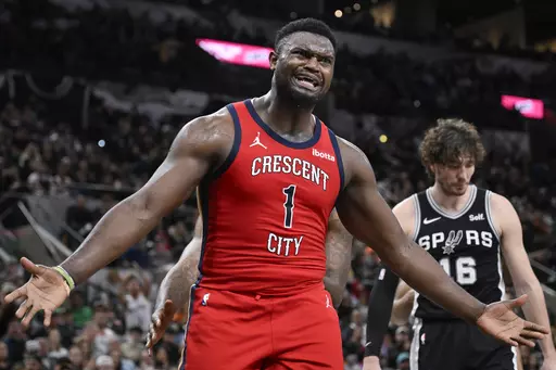 New Orleans Pelicans' Zion Williamson (1) gestures to a referee during the second half of an NBA basketball game against the San Antonio Spurs, Friday, Feb. 2, 2024, in San Antonio. (AP Photo/Darren Abate)