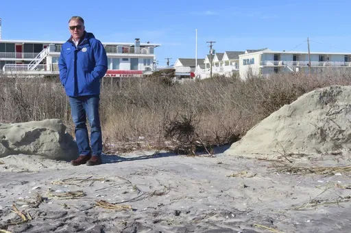 Mayor Patrick Rosenello stands next to a destroyed section of sand dune in North Wildwood N.J. on Jan. 22, 2024. (AP Photo/Wayne Parry, FILE)