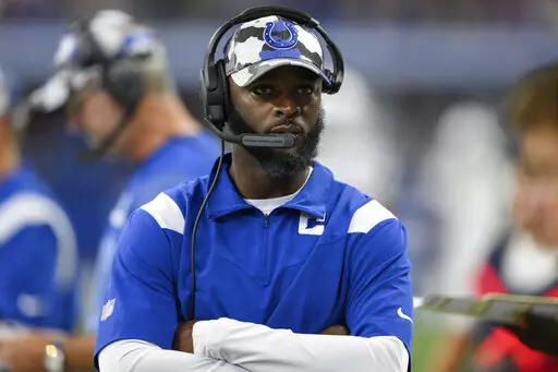Indianapolis Colts wide receiver coach Reggie Wayne on the sidelines during an NFL football game against the Detroit Lions on Aug. 20, 2022, in Indianapolis. Wayne is part of a new trend in hiring for coaches at the Colts. (AP Photo/Zach Bolinger, File)