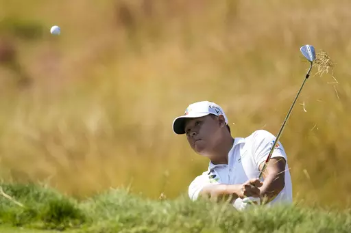 Si Woo Kim hits from the rough on the eighth hole during the second round of the U.S. Open golf tournament at Los Angeles Country Club on Friday, June 16, 2023, in Los Angeles. (AP Photo/Marcio J. Sanchez)
