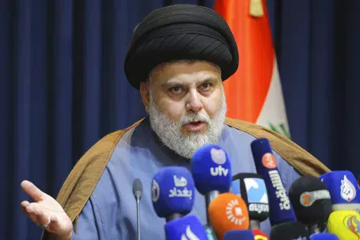 Populist Shiite cleric Muqtada al-Sadr, speaks during a mews conference in Najaf, Iraq, Thursday, Nov. 18, 2021. On Sunday, June 12, 2022, 73 lawmakers from the powerful cleric’s bloc submitted their resignation based on his request, to protest a persisting political deadlock eight months after general elections were held. (AP Photo/Anmar Khalil, File)