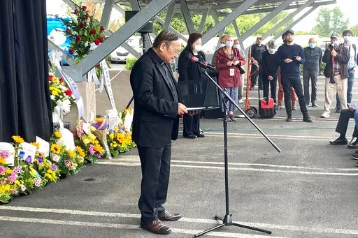 Pastor Albany Lee addresses congregants and community members on Saturday, May 21, 2022, as survivors and church leaders join in prayer and thank community members for their support nearly a week after a deadly shooting at a Taiwanese American church congregation in Laguna Woods, Calif. The community is reeling after the attack on a luncheon of the Irvine Taiwanese Presbyterian Church that killed one and wounded five. Lee said trauma specialists will be available to assist community members. (AP