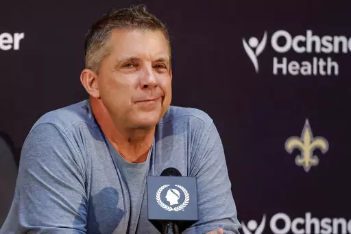 Sean Payton reacts during an NFL football press conference announcing his resignation as head coach of the New Orleans Saints, Tuesday, Jan. 25, 2022, in Metairie, La. Sean Payton isn't on the sidelines this season, but he will have a great viewing spot for games on Sunday. The former New Orleans Saints coach will spending his weekends on the Fox Sports set in Los Angeles as a studio analyst for their NFL shows. (AP Photo/Derick Hingle, File)