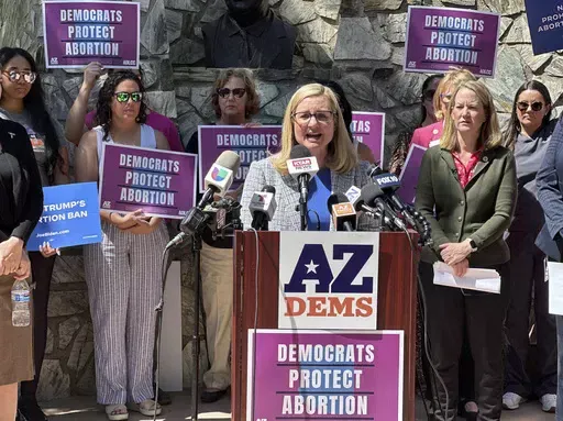 Phoenix Mayor Kate Gallego speaks to reporters at the state Capitol in Phoenix on April 9, 2024. The near-total abortion ban resurrected last week by the Arizona Supreme Court dates to 1864, a time when gold-seekers were moving in, dueling had to be regulated and the U.S. Army was forcibly removing Native Americans from their land. The law's revival is just the latest instance of long-dormant restrictions influencing current abortion policies after the overturning of Roe v. Wade. (AP Photo/Jonat