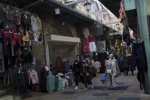 Muslim women walk through a market, ahead of the holy Islamic month of Ramadan, in the Old City of Jerusalem, Thursday, March 7, 2024. Restrictions put in place amid the Israel-Hamas war have left many Palestinians concerned they might not be able to pray at Al-Aqsa Mosque compound, which is revered by Muslims. (AP Photo/Leo Correa, File)