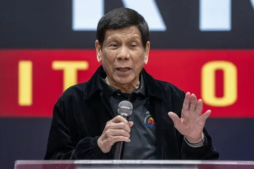 Former President of the Philippines Rodrigo Duterte speaks inside the Southorn Stadium during a thanksgiving gathering organized by Hong Kong-based Filipino workers for the former populist president in Hong Kong on March 9, 2025. (AP Photo/Vernon Yuen, File)