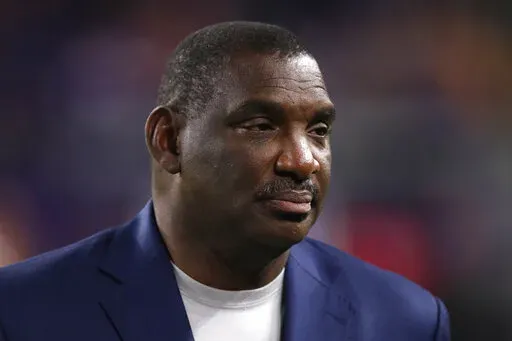 Washington Redskins Senior Vice President of Player Personnel Doug Williams walks the sidelines before an NFL football game between the Washington Redskins and the Minnesota Vikings, Thursday, Oct. 24, 2019, in Minneapolis. The inaugural Legacy Bowl in New Orleans is giving top football players from historically black colleges and universities a new level of exposure to pro scouts and executives. The Legacy Bowl is the brainchild of former NFL quarterbacks Doug Williams and James “Shack” Har