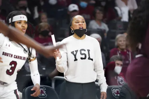 South Carolina head coach Dawn Staley communicates with players during the second half of an NCAA college basketball game against Mississippi State Sunday, Jan. 2, 2022, in Columbia, S.C. South Carolina won 80-68. (AP Photo/Sean Rayford)