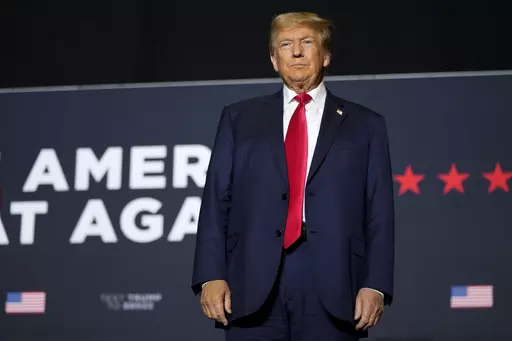 Former President Donald Trump arrives at a rally, Sunday, Oct. 1, 2023, in Ottumwa, Iowa. Trump is campaigning in a part of the state that he flipped from Democratic control in 2016. (AP Photo/Charlie Neibergall)