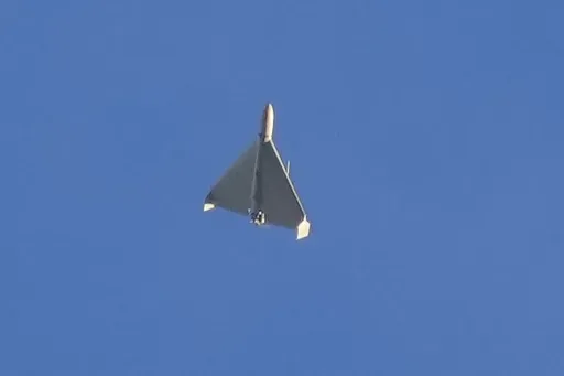 An Iranian Shahed exploding drone launched by Russia flies through the sky seconds before it struck buildings in Kyiv, Ukraine, on Oct. 17, 2022. (AP Photo/Efrem Lukatsky, File)