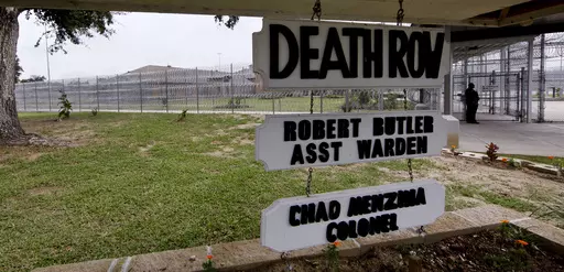 A sign hangs at the Death Row building at the Louisiana State Penitentiary, Sept. 18, 2009 in Angola, La. Louisiana Gov. Jeff Landry on Wednesday, Jan 31, 2024, hinted at his willingness to explore expanding the state’s methods of executing those on death row, saying that he is committed to upholding “contractual obligations” between the state and victims’ families after the death penalty has been handed down in court. ( AP Photo/Judi Bottoni, File )