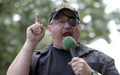 Stewart Rhodes, founder of the Oath Keepers, speaks during a rally outside the White House in Washington, June 25, 2017. (AP Photo/Susan Walsh, File)