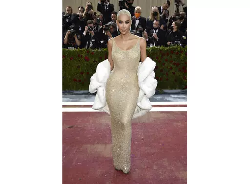 Kim Kardashian wears the iconic dress worn by Marilyn Monroe at The Metropolitan Museum of Art's Costume Institute benefit gala in New York on May 2, 2022.  Some Monroe enthusiasts believe the dress was damaged after Kardashian wore it but the Ripley’s Believe It or Not! attraction in Hollywood, Calif., where the garment is on display, denies that claim. (Photo by Evan Agostini/Invision/AP, File)