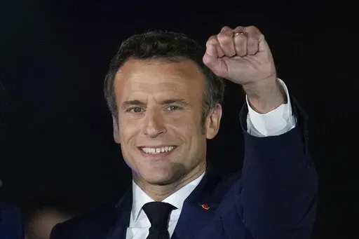 French President Emmanuel Macron celebrates with his supporters in Paris, France, Sunday, April 24, 2022. French President Emmanuel Macron's reelection has bolstered his standing as a senior player in Europe. Macron is now expected to push for strengthening the 27-nation bloc and throw all his weight behind efforts to end the war in Ukraine. (AP Photo/Christophe Ena, File)