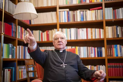 German Cardinal Gerhard Mueller speaks during an interview with The Associated Press in his apartment in Rome, Wednesday, Jan. 4, 2023. Benedict gave his fellow German theologian his old job, as prefect of the Vatican’s doctrine office. He entrusted his life’s theological works to Mueller, who has spent nearly two decades organizing them in a 16-volume, 25,000-page opus along the lines of Thomas Aquinas’ Summa Theologica. He gave him his old flat on the top floor of a Vatican apartment bui