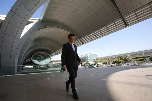 Dubai Airports CEO Paul Griffiths walks out of the Dubai International Airport's Terminal 3 in Dubai, United Arab Emirates, June 17, 2014. Dubai International Airport, the world's busiest for international travel, announced on Thursday it handled over 13.6 million passengers in the first three months of 2022 — more than double last year's number in a clear sign that a long-awaited travel revival has come to the global aviation hub. (AP Photo/Kamran Jebreili, File)