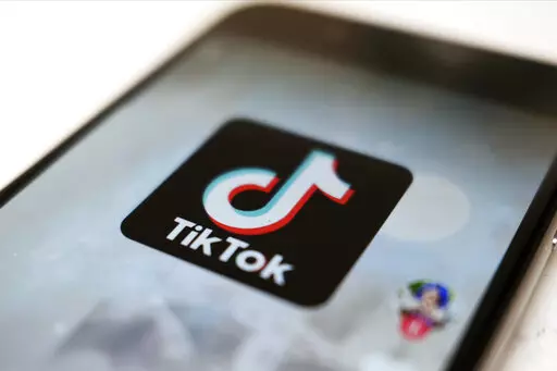 This Monday, Sept. 28, 2020, file photo, shows the TikTok logo on a smartphone in Tokyo. On Sunday, March 6, 2022, Netflix and TikTok suspended most of their services in Russia as the government cracks down on what people and media outlets can say about Russia's war in Ukraine. (AP Photo/Kiichiro Sato, File)
