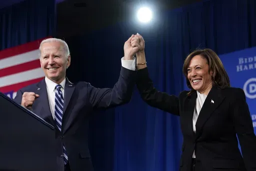 President Joe Biden and Vice President Kamala Harris stand on stage at the Democratic National Committee winter meeting, Feb. 3, 2023, in Philadelphia. (AP Photo/Patrick Semansky, File)