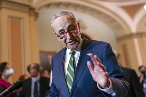 Senate Majority Leader Chuck Schumer, D-N.Y., meets with reporters following a Democratic Caucus meeting, at the Capitol in Washington, Tuesday, April 5, 2022. (AP Photo/J. Scott Applewhite)