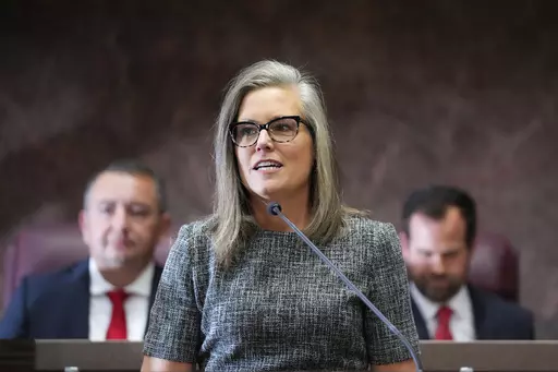 Democratic Arizona Gov. Katie Hobbs, center, delivers her state of the state address at the Arizona Capitol in Phoenix on Jan. 9, 2023. The Arizona Supreme Court has ruled that state law doesn’t require Gov. Katie Hobbs to carry out execution of a prisoner who is scheduled to be put to death on April 6 for his conviction in a 2002 killing. (AP Photo/Ross D. Franklin, File)