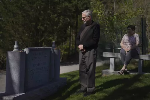Co-presidents of New Light Congregation, Stephen Cohen and Barbara Caplan, visit a memorial in the New Light Cemetery on Wednesday, April 19, 2023, in Shaler Township, Pa., honoring the congregants they lost during the Pittsburgh synagogue massacre over four years ago. Jury selection is scheduled to begin on Monday, April 24, for the suspect accused of invading the Tree of Life synagogue building on that Sabbath morning and murdering 11 worshippers from three congregations. (AP Photo/Jessie Ward