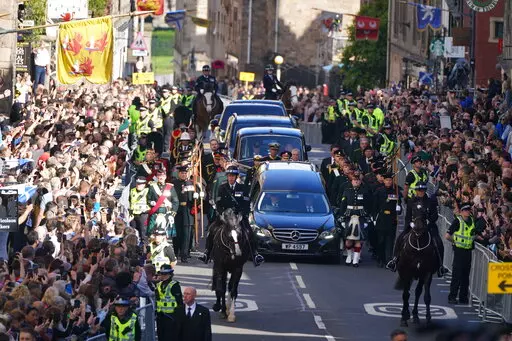 King Charles III,  Princess Anne and members of the Royal family join the procession of Queen Elizabeth II's coffin from the Palace of Holyroodhouse to St Giles' Cathedral, in Edinburgh, Monday, Sept. 12, 2022. King Charles arrived in Edinburgh on Monday to accompany his late mother’s coffin on an emotion-charged procession through the historic heart of the Scottish capital to the cathedral where it will lie for 24 hours to allow the public to pay their last respects. (Andrew Milligan/Pool Pho
