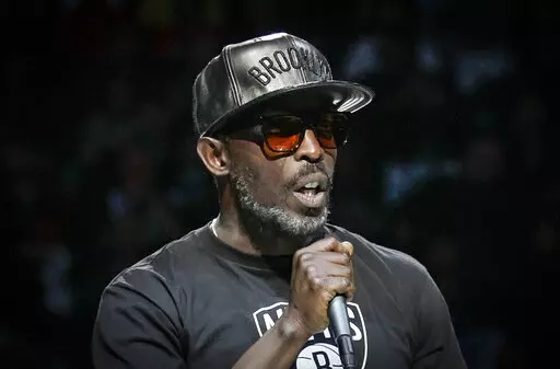 Actor Michael K. Williams introduces the Brooklyn Nets starting lineup during NBA basketball first-round playoffs Friday, April 25, 2014, in New York. A federal prosecutor said Wednesday, Feb. 2, 2022, four men have been charged in the overdose death of Williams, who gained fame playing Omar Little on "The Wire." (AP Photo/Frank Franklin II, File)