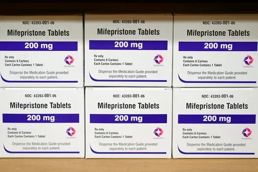 Boxes of the drug mifepristone sit on a shelf at the West Alabama Women's Center in Tuscaloosa, Ala., on March 16, 2022. On Tuesday, Jan. 3, 2023, the Food and Drug Administration finalized a rule change that allows women seeking abortion pills to get them through the mail, replacing a long-standing requirement that they pick up the medicine in person. (AP Photo/Allen G. Breed, File)