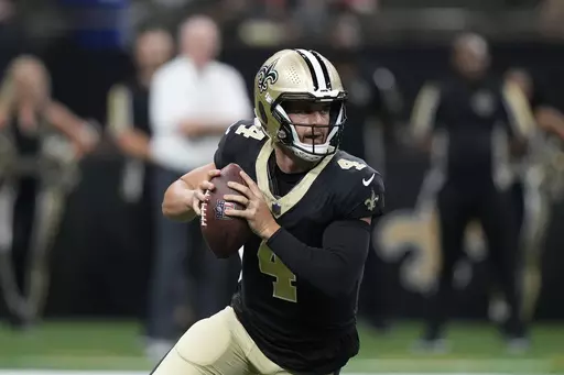 New Orleans Saints quarterback Derek Carr (4) looks to pass the ball in the first half of a preseason NFL football game against the Kansas City Chiefs in New Orleans, Sunday, Aug. 13, 2023. (AP Photo/Gerald Herbert)