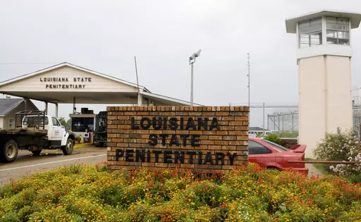 Vehicles enter at the main security gate at the Louisiana State Penitentiary — the Angola Prison, the largest high-security prison in the country in Angola, La., Aug. 5, 2008. A federal judge ruled on Friday, Sept. 8, 2023 that incarcerated youths be removed from a temporary lockup, at a former death row building in Louisiana’s adult maximum-security prison.(AP Photo/Judi Bottoni, File)