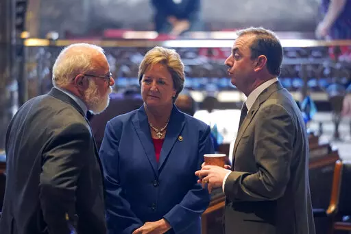 Bret Allain, R-Franklin, left, chairman of the Senate Revenue and Fiscal Affairs Committee, talks with Sen. Sharon Hewitt,R-Slidell, and Sen. Patrick McMath, R-Covington, during opening day of the Louisiana legislative session in Baton Rouge, La., Monday, April 12, 2021. Hewitt announced on Friday, Jan. 13, 2023, that she will run for governor in October.(AP Photo/Gerald Herbert, File)