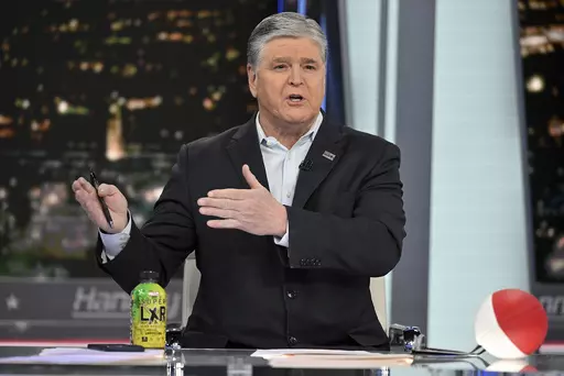 FILE- Fox News commentator Sean Hannity speaks during an interview at Fox News Studios, March 16, 2023, in New York. Tucker Carlson, Hannity and Bret Baier are among the stars that both Fox News and the voting machine company suing it for defamation have signaled could testify if the explosive case heads to trial next month.(Photo by Evan Agostini/Invision/AP)