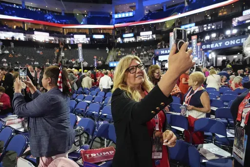 A delegate takes a selfie at the Republican National Convention Monday, July 15, 2024, in Milwaukee. (AP Photo/Nam Y. Huh)