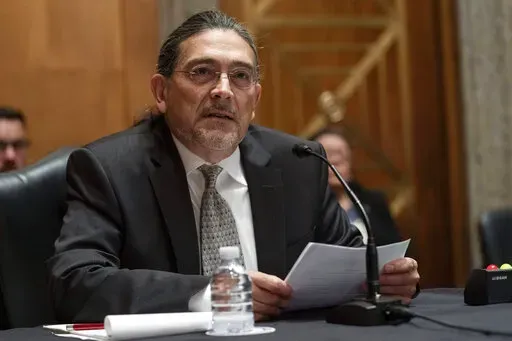 Census Bureau Director nominee Robert Santos, testifies before the Senate Homeland Security and Governmental Affairs committee, Thursday, July 15, 2021, on Capitol Hill in Washington.  Santos said Monday, Feb. 21, 2022,  that he has gone on a listening tour with stakeholders and the agency is making permanent community outreach efforts in an effort to restore any trust that was lost following attempts by the Trump administration to politicize the nation's head count. (AP Photo/Jacquelyn Martin, 