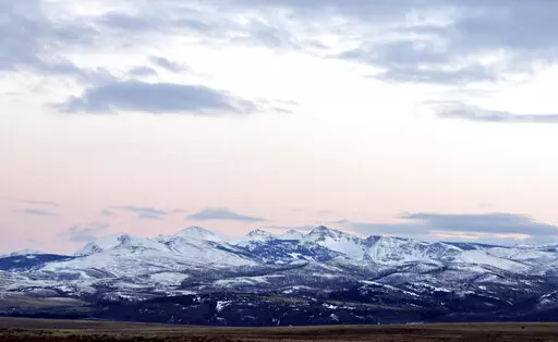 In this March 25, 2016, file photo, the sun sets over the Badger-Two Medicine area near Browning, Mont. The cultural leaders of the Blackfeet tribe filed an appeal Tuesday, Nov. 1, 2022, against a judge's recent order to reinstate an oil and gas lease that was first issued four decades ago in an area adjacent to Glacier National Park and the Blackfeet Reservation in Montana. The area is considered sacred to the Blackfeet. (Greg Lindstrom/Flathead Beacon via AP, File)