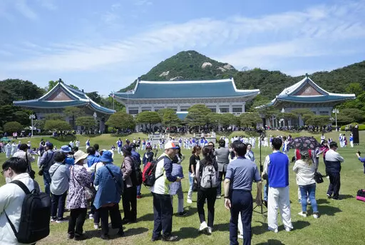 People visit the Blue House, the former presidential palace, in Seoul, South Korea, Tuesday, May 10, 2022. For most South Koreans, the former presidential palace in Seoul was as shrouded in mystery as the buildings in their secretive rival North Korea. That’s now changed recently as thousands have been allowed a look inside for the first time in 74 years.(AP Photo/Ahn Young-joon)