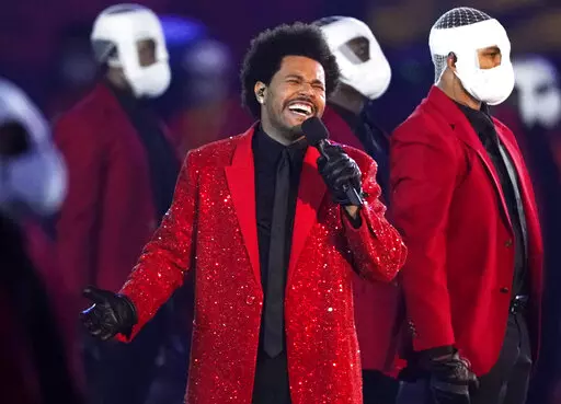 The Weeknd performs during the halftime show of the NFL Super Bowl 55 football game between the Kansas City Chiefs and Tampa Bay Buccaneers, on Feb. 7, 2021, in Tampa, Fla. The Weeknd, along with Swedish House Mafia, will replace rapper Ye, who changed his name from Kanye West, in a headlining spot at Coachella Valley Music and Arts Festival.  (AP Photo/Ashley Landis, File)