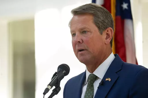 Georgia Gov. Brian Kemp speaks at Ola High School July 29, 2022, in McDonough, Ga. The shadow of Donald Trump's tampering with the 2020 election in Georgia lands differently for the various Republicans running for office in 2022. (AP Photo/Megan Varner, File)