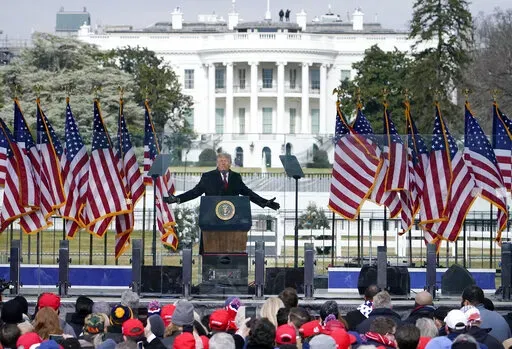 The White House in the background, President Donald Trump speaks at a rally in Washington, Jan. 6, 2021. The House committee investigating the U.S. Capitol insurrection is asking Ivanka Trump, daughter of former President Donald Trump, to voluntarily cooperate with its investigation.  (AP Photo/Jacquelyn Martin, File)