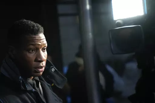 Jonathan Majors leaves a courtroom in New York, Monday, Dec. 18, 2023. Majors was convicted of assaulting his former girlfriend during a confrontation in New York City earlier this year. A Manhattan jury convicted the Marvel star Monday of one misdemeanor assault charge and one harassment violation. (AP Photo/Seth Wenig)