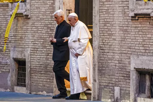Pope Francis is flanked by Jesuits' superior general Arturo Sosa Abascal, left as he leaves the Church of the Gesu', mother church of the Society of Jesus (Jesuits), after presiding a mass on March 12, 2022. The head of Pope Francis’ Jesuit religious order admitted Wednesday, Dec. 14, 2022, that a famous Jesuit priest had been convicted of one of the most serious crimes in the Catholic Church some two years before the Vatican decided to shelve another case against him for allegedly abusing oth
