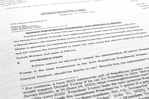 A court filing by lawyers for former President Donald Trump is photographed Monday, Aug. 22, 2022, as lawyers ask a federal judge to prevent the FBI from continuing to review documents recovered from his Florida estate until a neutral special master can be appointed. The attorneys asserted in a court filing, their first since the FBI search of Mar-a-Lago two weeks ago, that the sets of documents taken from the residence were "presumptively" covered by executive privilege. (AP Photo/Jon Elswick)