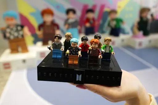 A LEGO set made of its blocks featuring K-pop band BTS, is shown during a publicity event at a store in Seoul, South Korea, on March 2, 2023. Danish toy company Lego said Tuesday March 7, 2023 that its net profit increased by 5% in 2022 coming in at 13.9 billion kroner ($2 billion), up from 13.3 billion kroner a year earlier. (AP Photo/Lee Jin-man, File)