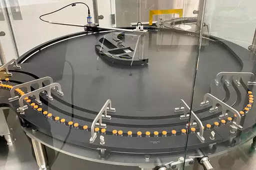 This provided by Pfizer in October 2022 shows manufacturing of the company's COVID-19 bivalent vaccine for ages 5-11.  The U.S. on Wednesday, Oct. 12,  authorized updated COVID-19 boosters for children as young as 5, seeking to expand protection ahead of an expected winter wave.(Pfizer via AP)