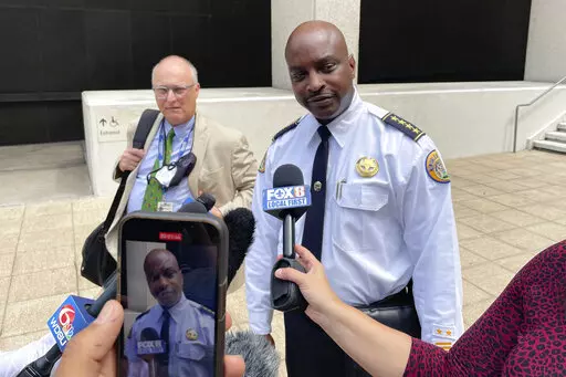 New Orleans Police Superintendent Shaun Ferguson talks to reporters outside the federal courthouse in New Orleans on Aug. 17, 2022. Hoping to beef up a dwindling police force amid a rise in violent crime, New Orleans officials announced a three-year $80 million plan Thursday, Sept. 8, 2022, offering raises for all officers, free health care and $30,000 in incentive payments for new hires. (AP Photo/Kevin McGill, File)