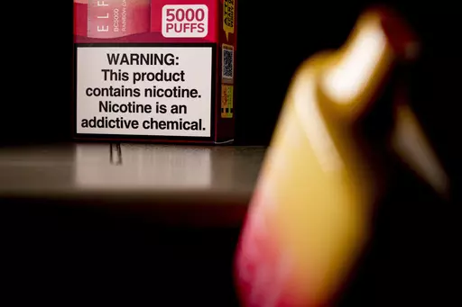 A health warning is seen on the packaging of a disposable vaping pod device in Washington on Monday, June 26, 2023. Sixty years ago, the U.S. surgeon general released a report that settled a longstanding public debate about the dangers of cigarettes and led to huge changes in smoking in America. Some public health experts say a similar report could help clear the air about vaping.(AP Photo/Andrew Harnik, File)